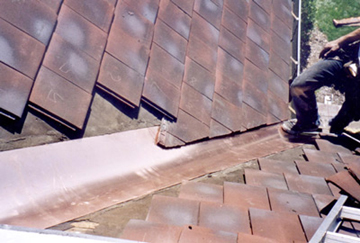 Valley replacement on interlocking tile roof.