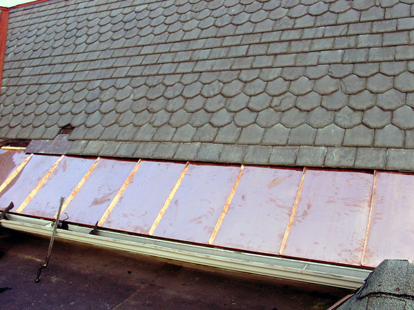 One Way To Install Standing Seam Copper Snow Aprons on a Slate Roof