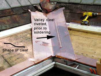 Copper Snow Aprons at slate roof central - valley cleat